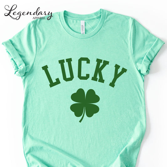A mint green t-shirt with the word "Lucky" printed on it, along with a four-leaf clover symbol.