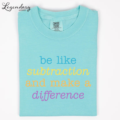 A turquoise t-shirt with the text "be like subtraction and make a difference" printed on it.