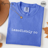 a blue t-shirt with the text "immediately no" printed on it.