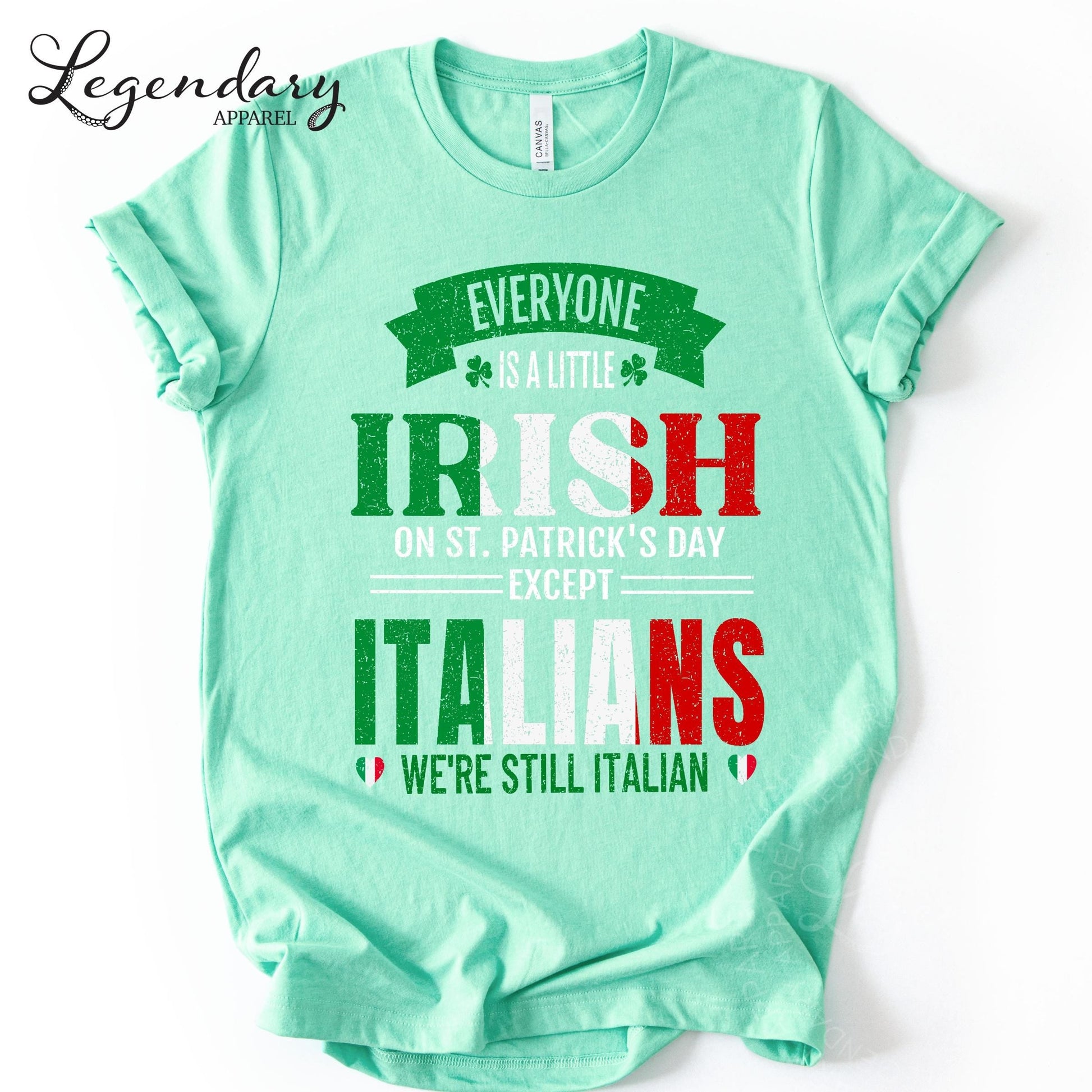 A mint green t-shirt with a humorous text printed on it.