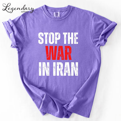 A purple t-shirt with the text "STOP THE WAR IN IRAN" printed on it.
