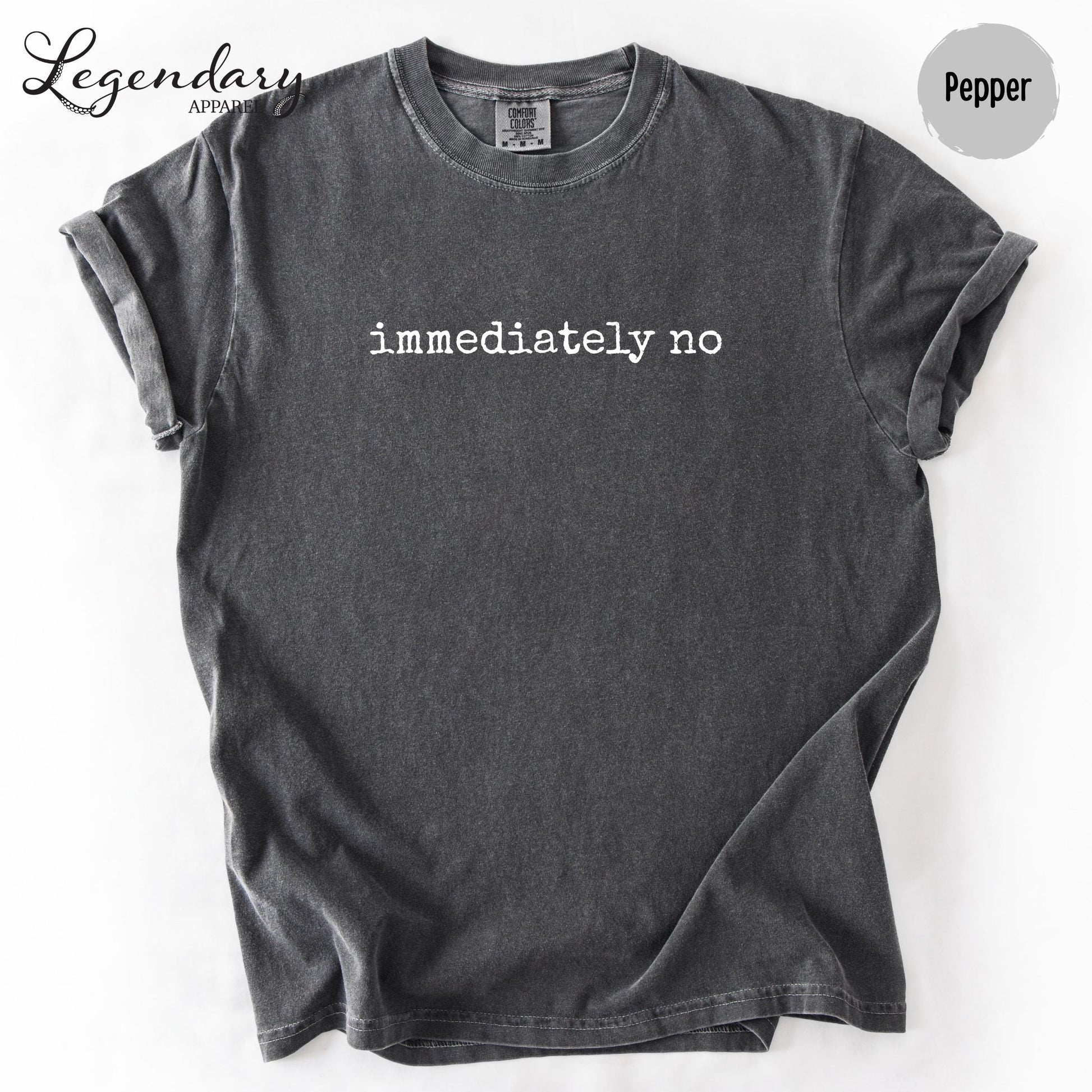 a gray t-shirt with the text "immediately no" printed on it.