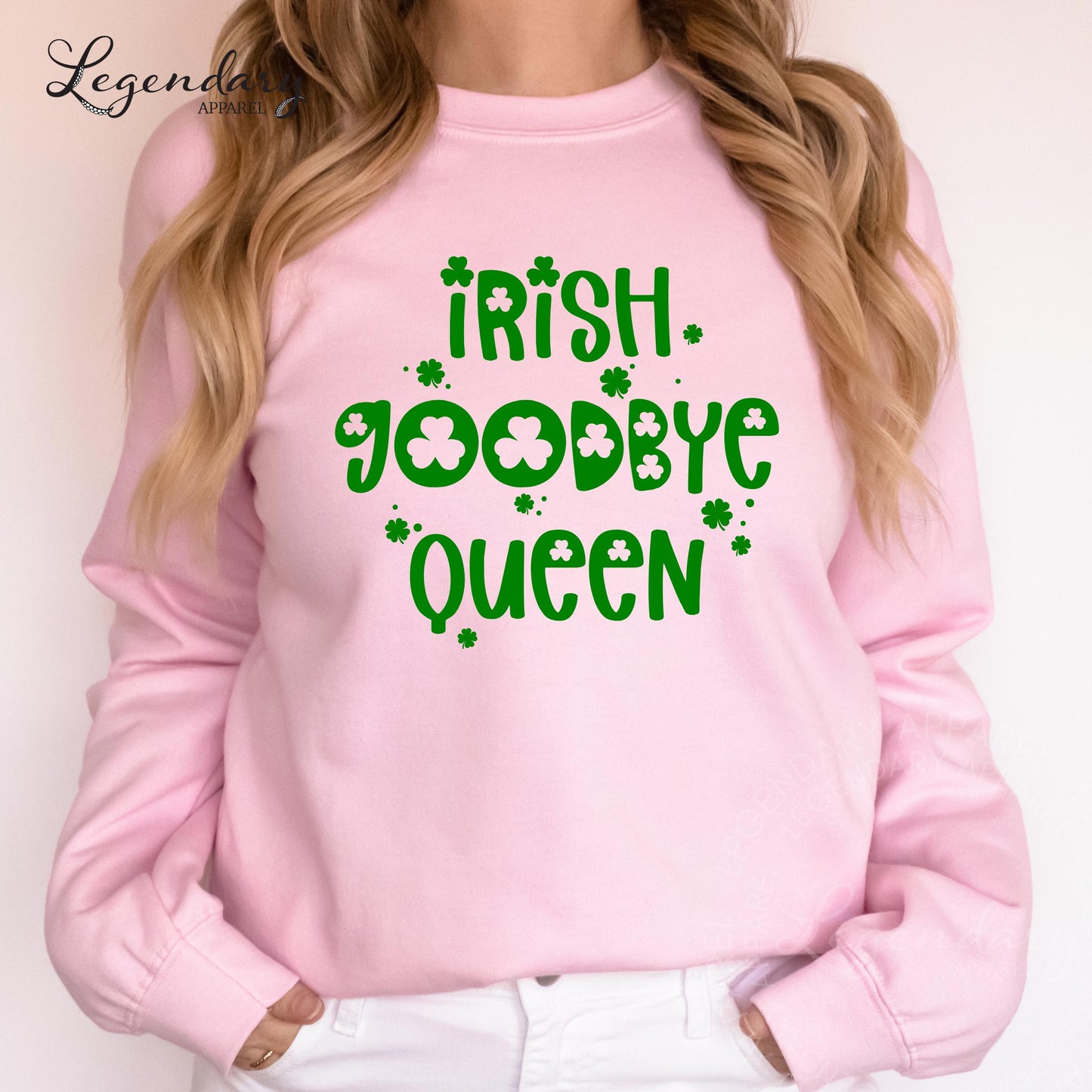 A woman wearing a pink sweatshirt with the text "Irish goodbye queen" printed on it.
