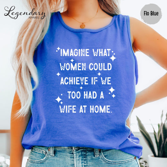 A woman wearing a blue tank top with white text printed on it.