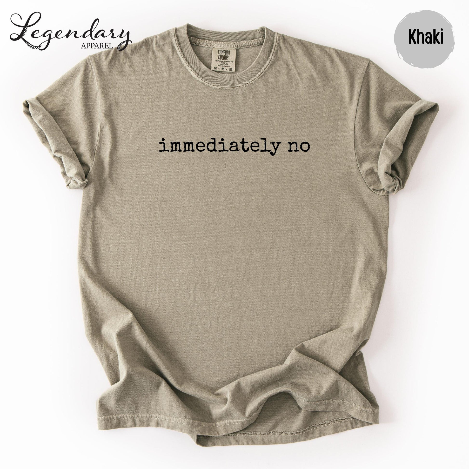a beige t-shirt with the text "immediately no" printed on it.