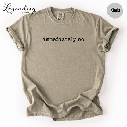 a beige t-shirt with the text "immediately no" printed on it.