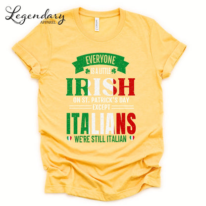 The image is a yellow t-shirt with text and graphics printed on it.