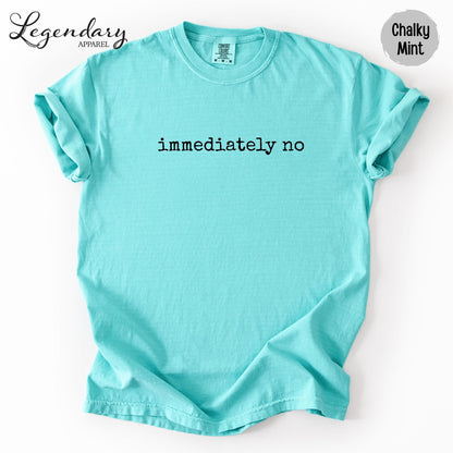 A turquoise t-shirt with the text "immediately no" printed on it.