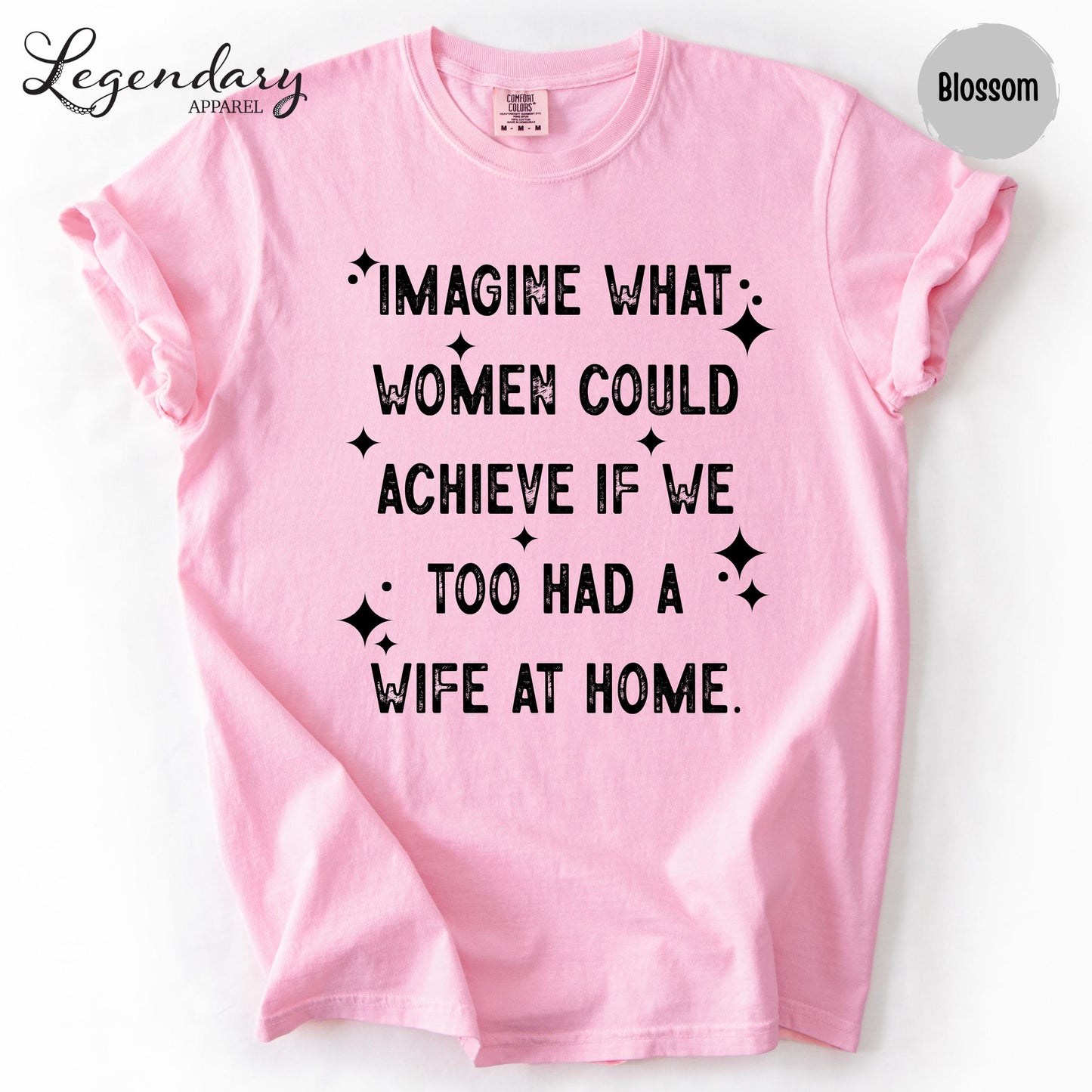 A pink t-shirt with a humorous text printed on it.