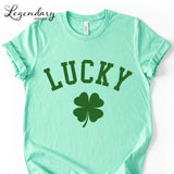 A mint green t-shirt with the word "Lucky" printed on it, along with a four-leaf clover symbol.