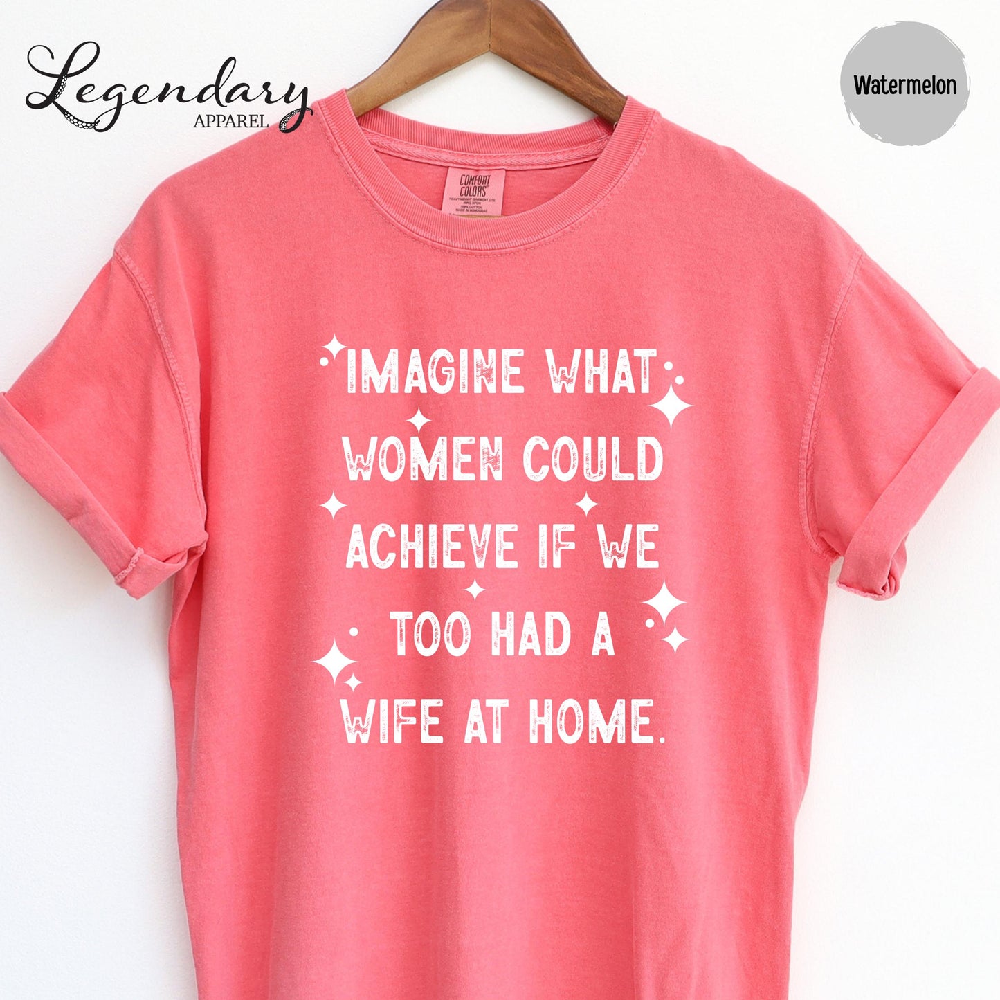A pink t-shirt with white text printed on it.