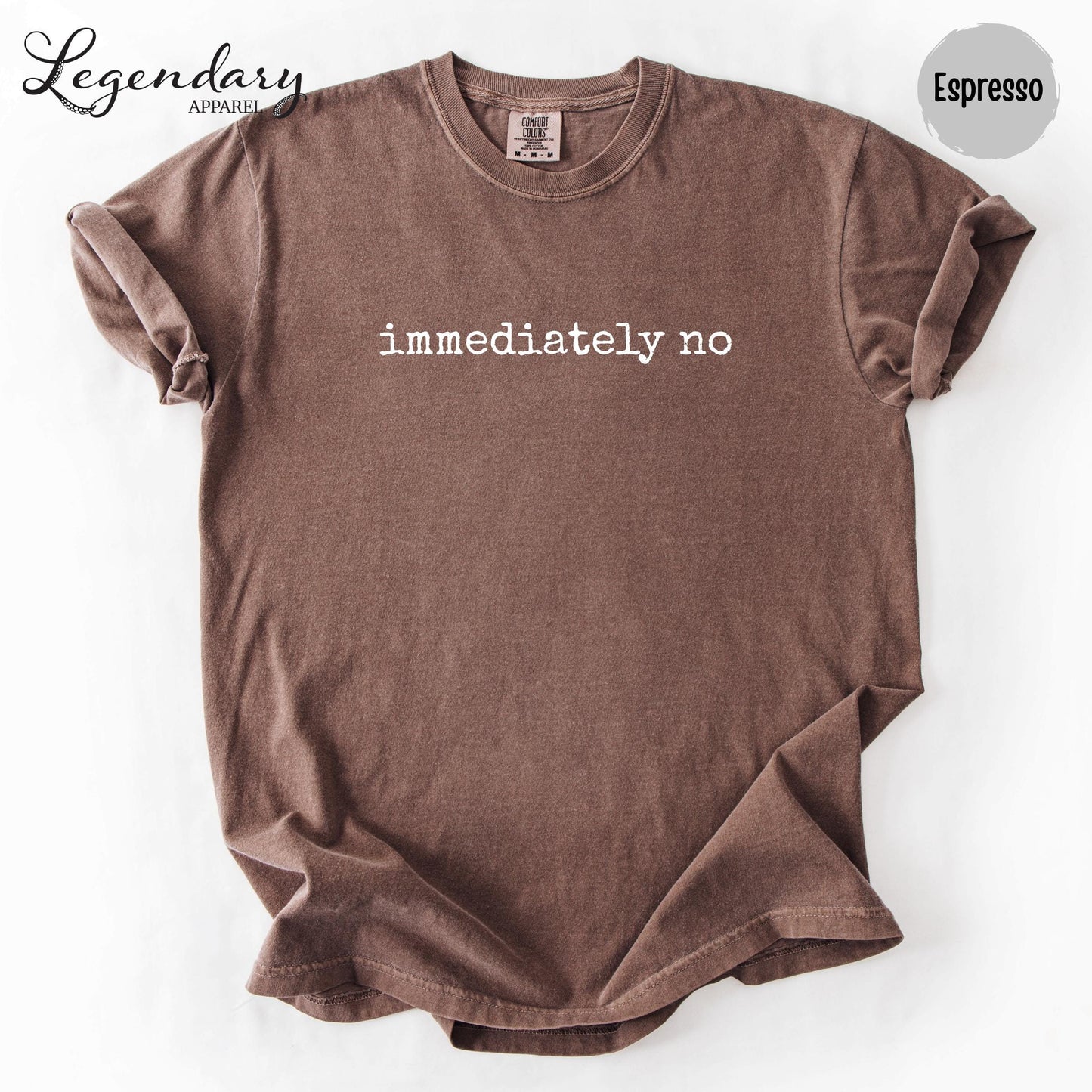 A brown t-shirt with the text "immediately no" printed on it.