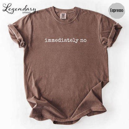 A brown t-shirt with the text "immediately no" printed on it.