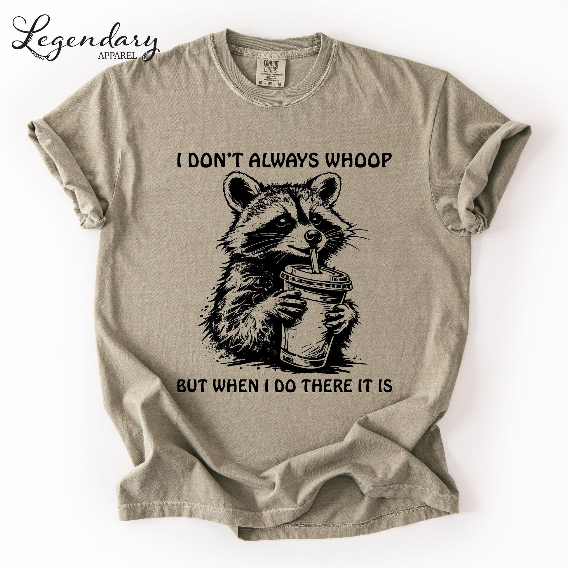 A t-shirt with a raccoon graphic and text that reads "I DON'T ALWAYS WHOOP BUT WHEN I DO THERE IT IS".