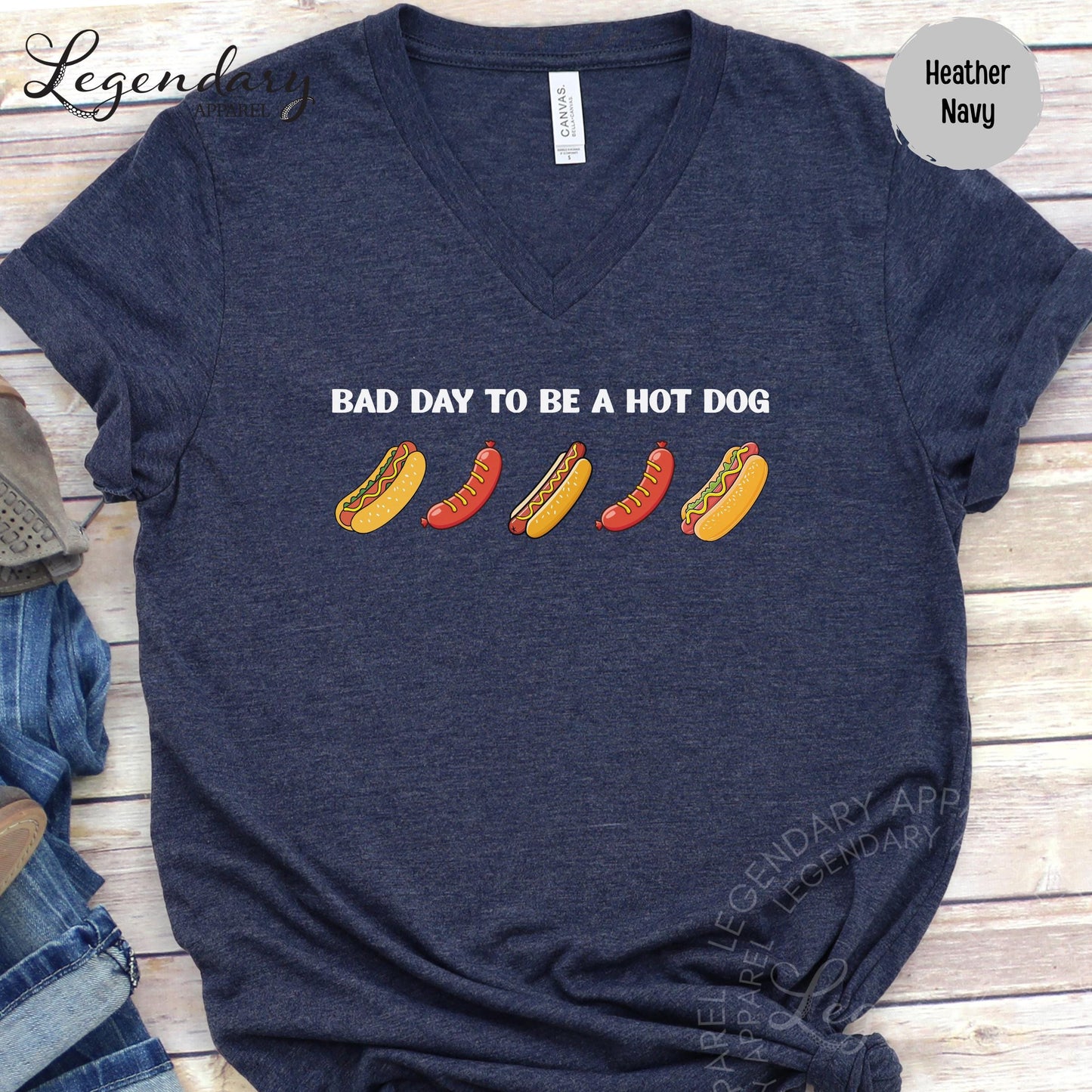 A navy blue t-shirt with a humorous text printed on it, which reads "Bad day to be a hot dog".