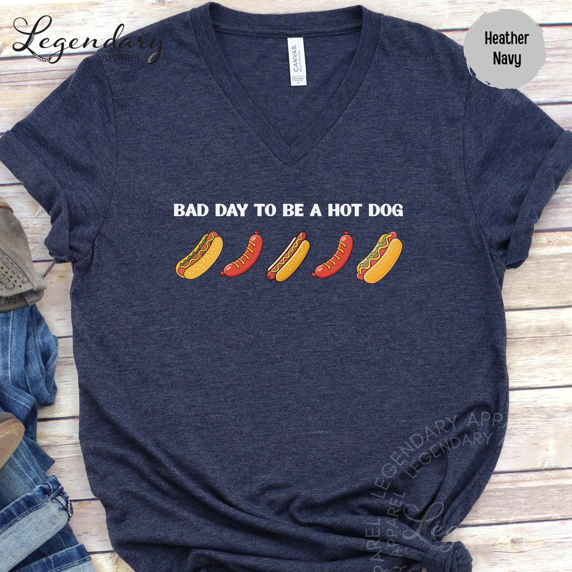 A navy blue t-shirt with a humorous text printed on it, which reads "Bad day to be a hot dog".